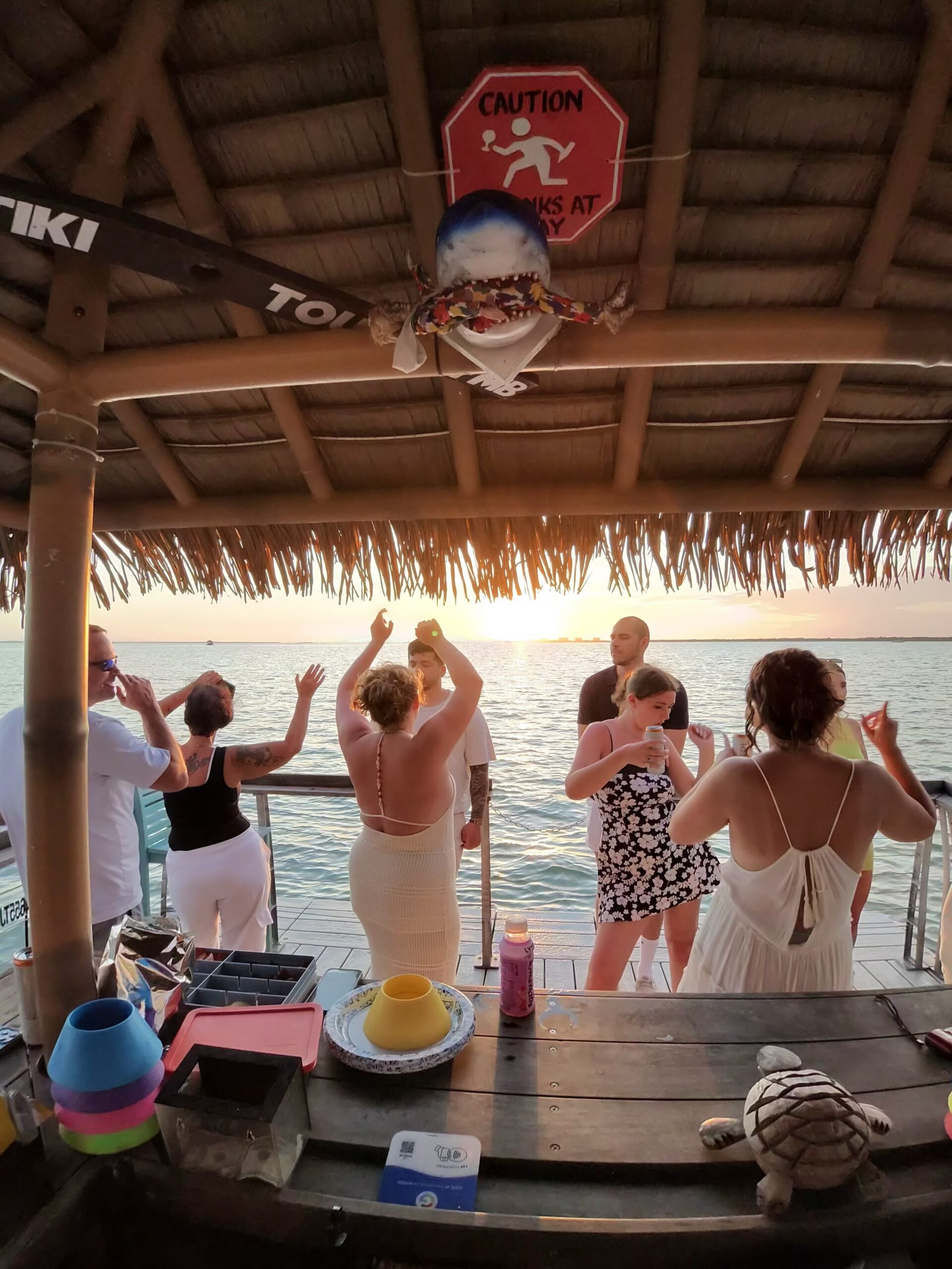 Guests dancing on the Big Tiki Tours FMB tiki boat